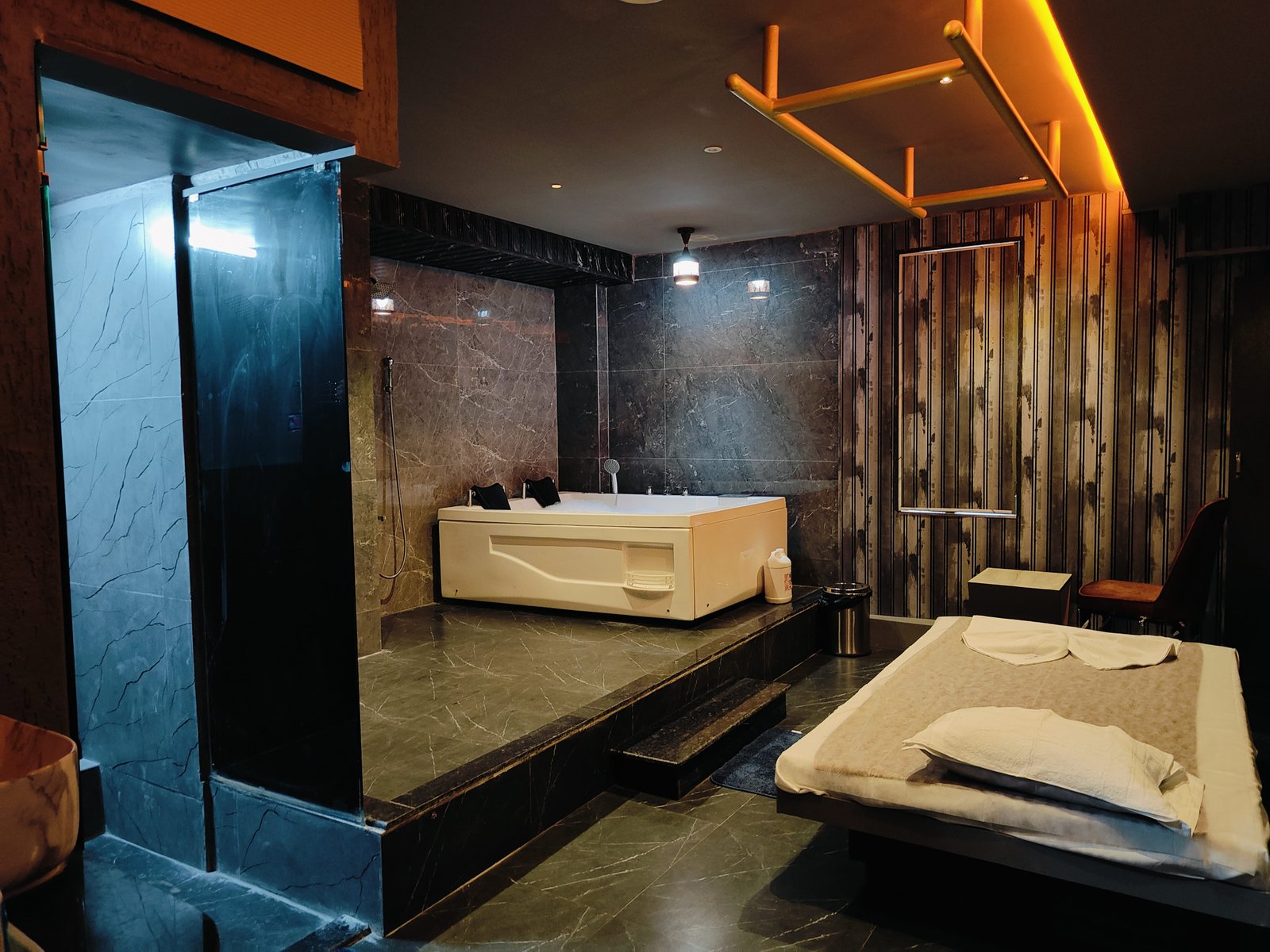 Therapist providing a relaxing spa treatment with essential oils at Sunshine Wellness Spa