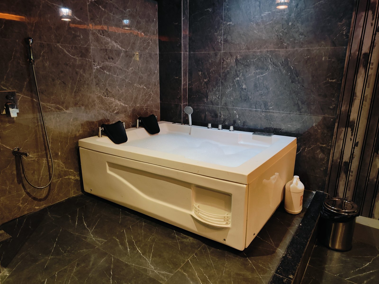 Therapist providing a relaxing spa treatment with essential oils at Sunshine Wellness Spa