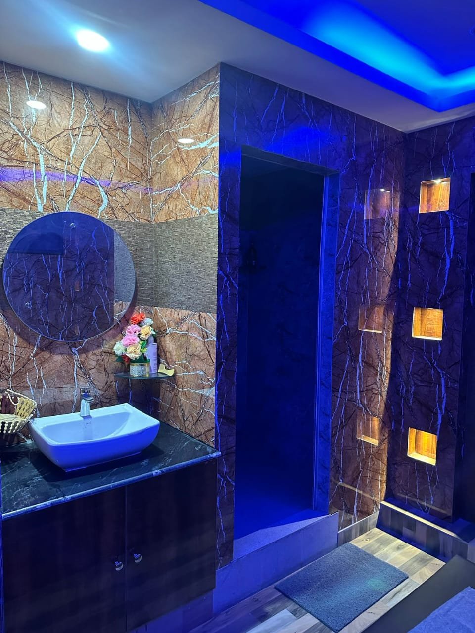 Modern spa room at Sunshine Wellness Spawith soft lighting and comfortable massage tables