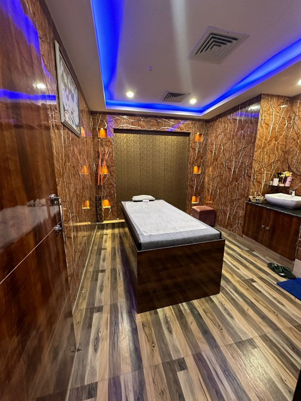 Modern spa room at Sunshine Wellness Spawith soft lighting and comfortable massage tables